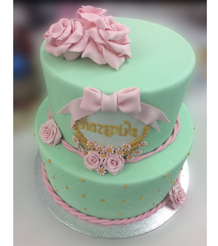 Birthday cake with sugar paste and pink roses