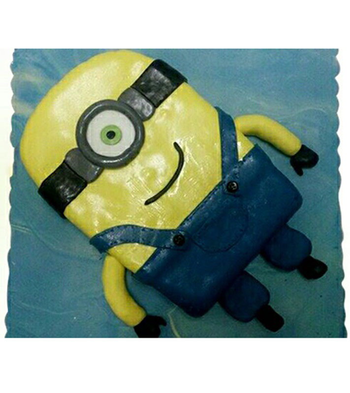 Sugar paste cake in the shape of minions