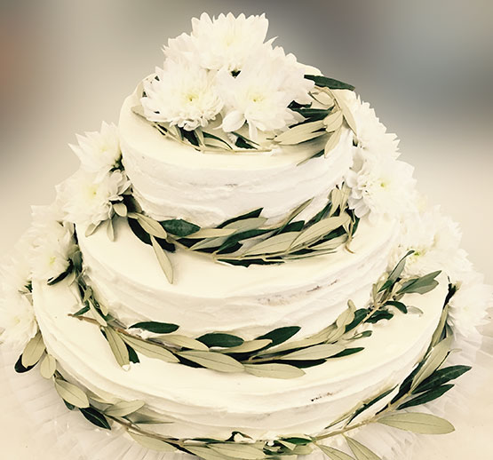 Wedding cake decorated with olive leaves